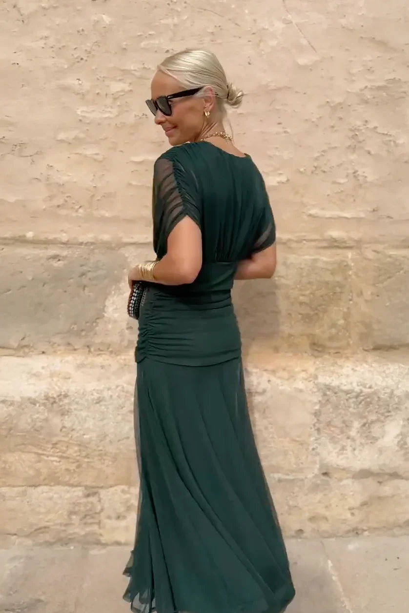 Full outfit featuring V-neck maxi dress styled for evening occasion
