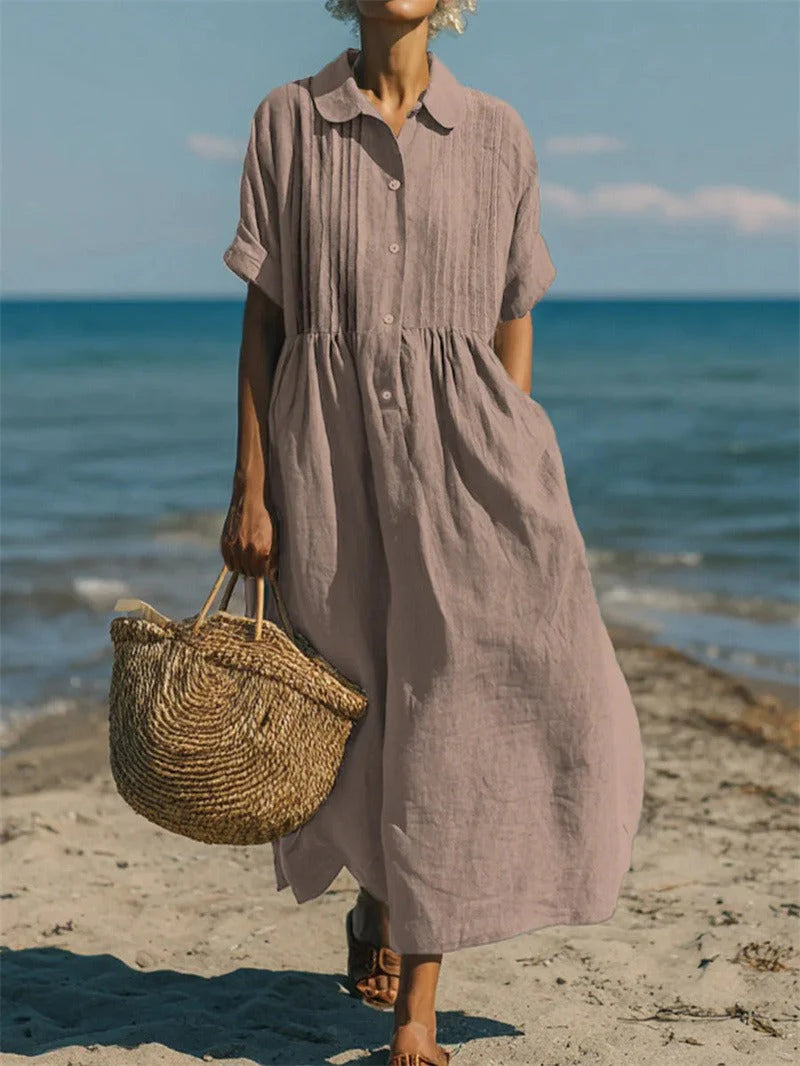 Full-length view of white midi shirt dress with rolled sleeves