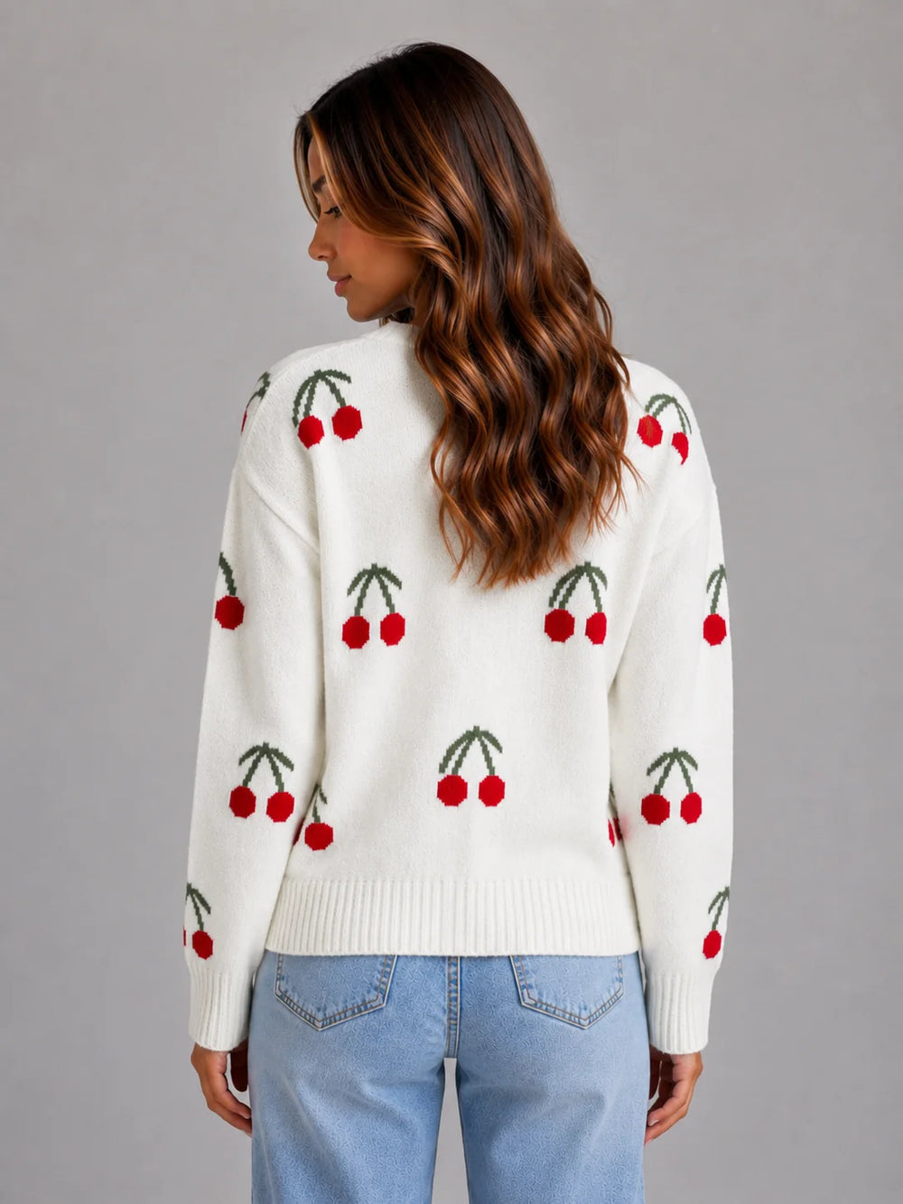 Front view of relaxed fit cherry print cardigan with V-neckline and soft knit fabric