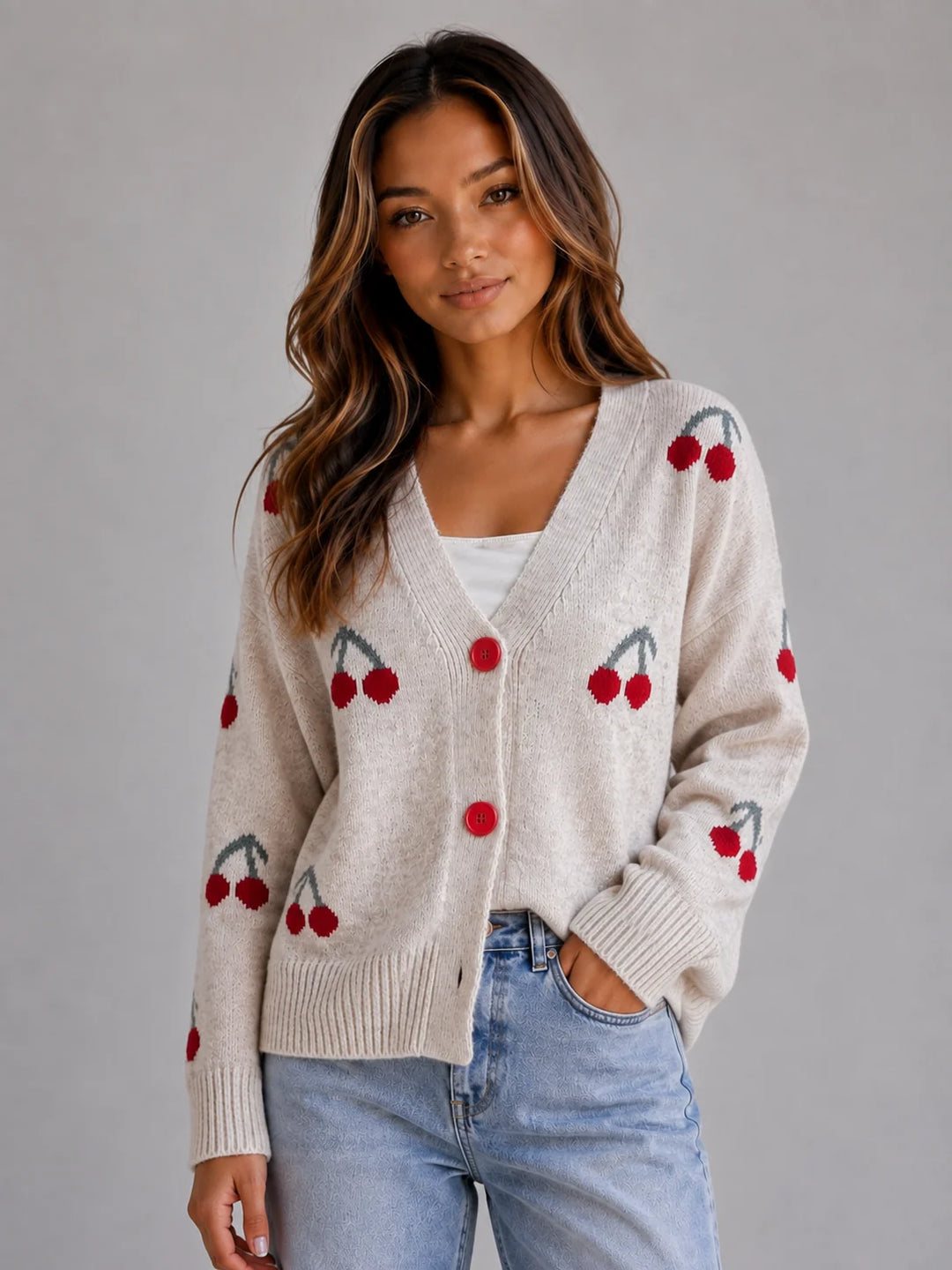 Side view of women's cherry print knit cardigan showing relaxed fit and ribbed hem