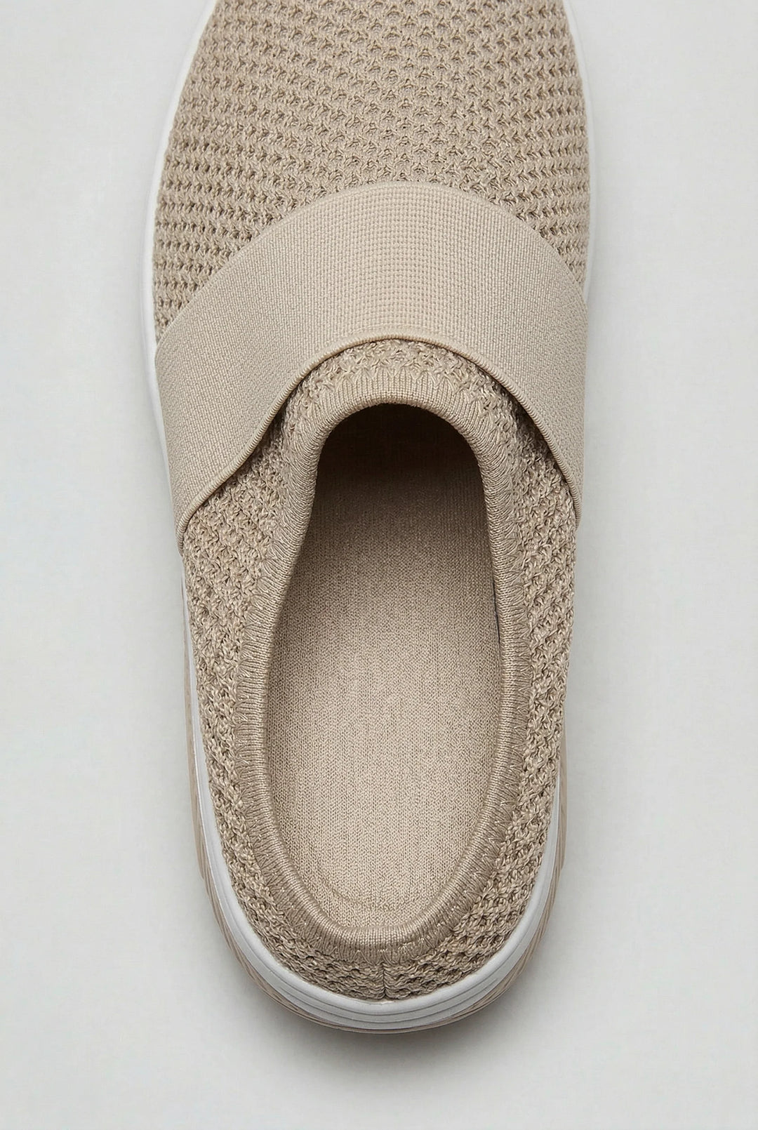 Close-up of women's mules highlighting the airy mesh texture and elastic strap detail