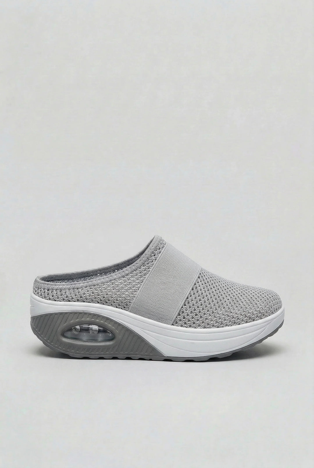 Detail of breathable mesh upper on women's mules with integrated air-cushion technology
