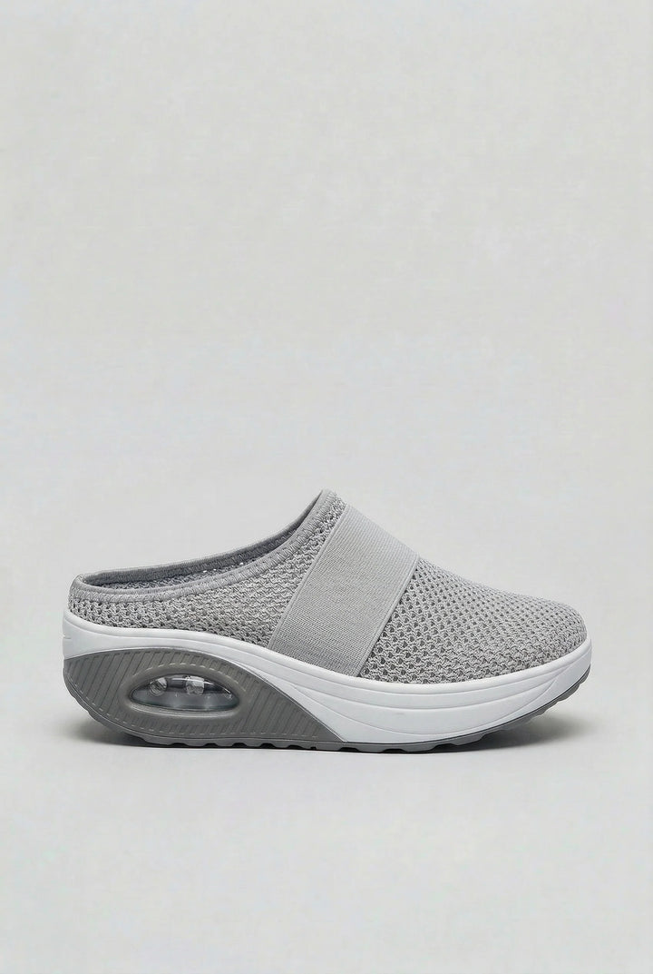 Detail of breathable mesh upper on women's mules with integrated air-cushion technology
