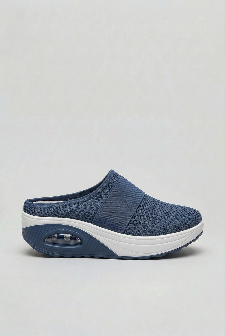 Rear view of open-back women's mules with breathable mesh and supportive air-cushion sole