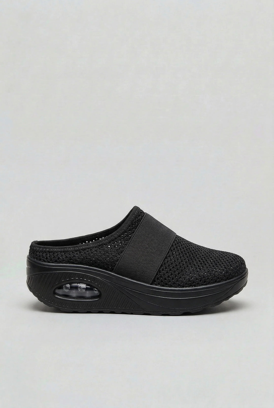 Women's mules with lightweight mesh construction and visible air-cushion sole for impact absorption