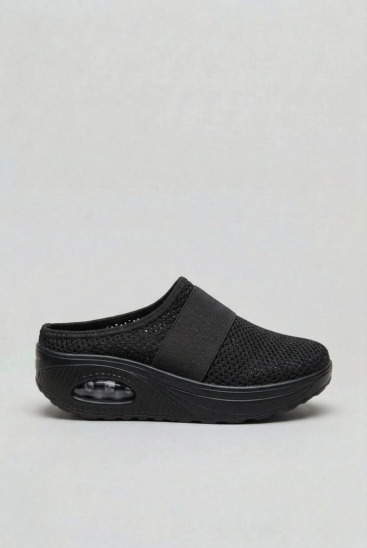 Women's mules with lightweight mesh construction and visible air-cushion sole for impact absorption