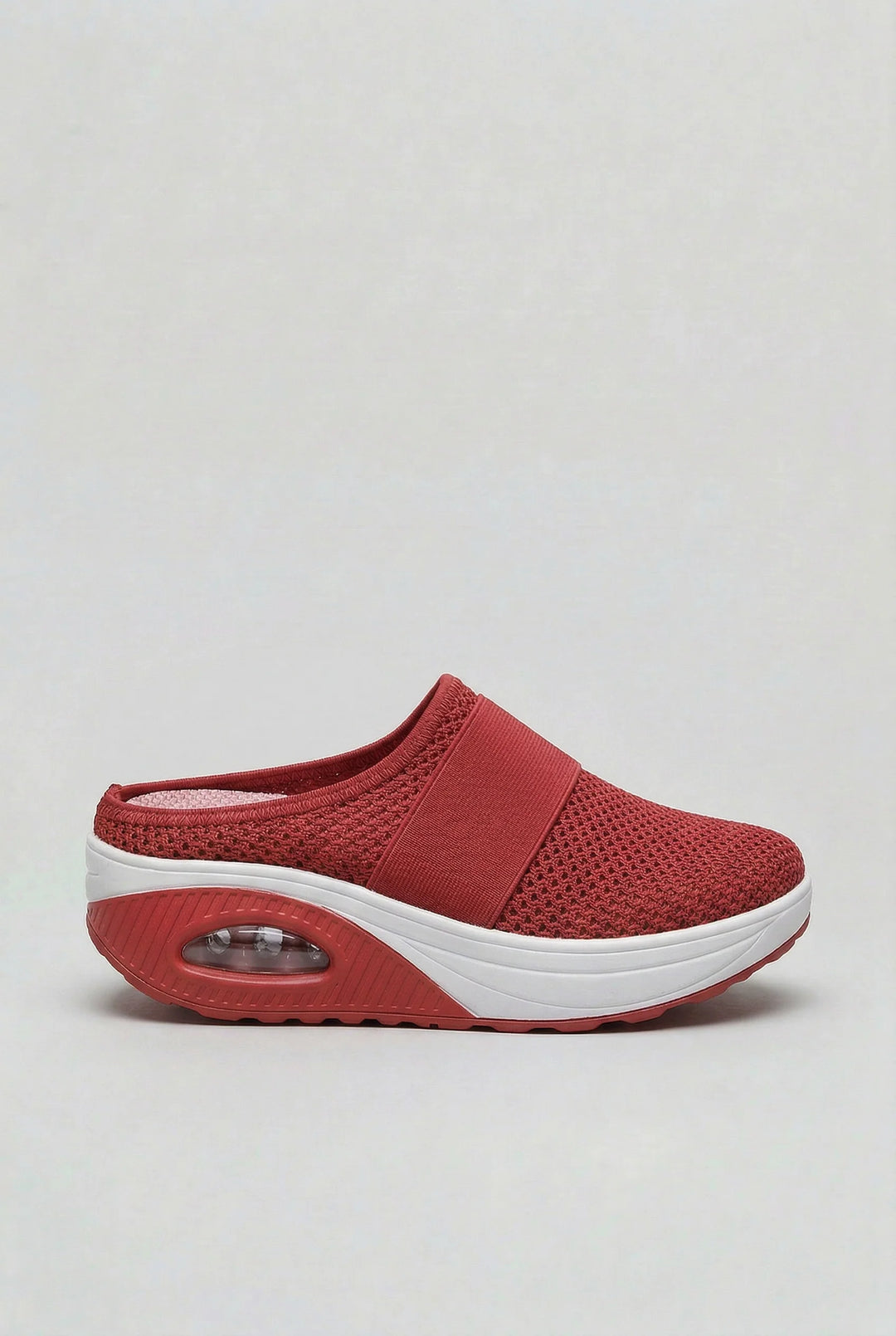 Full view of women's mules showcasing breathable mesh upper and ergonomic rocker sole design