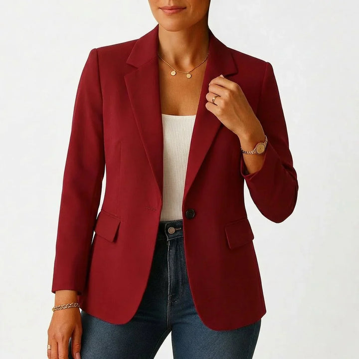 Women's blazer styled for office wear with trousers and ribbed top