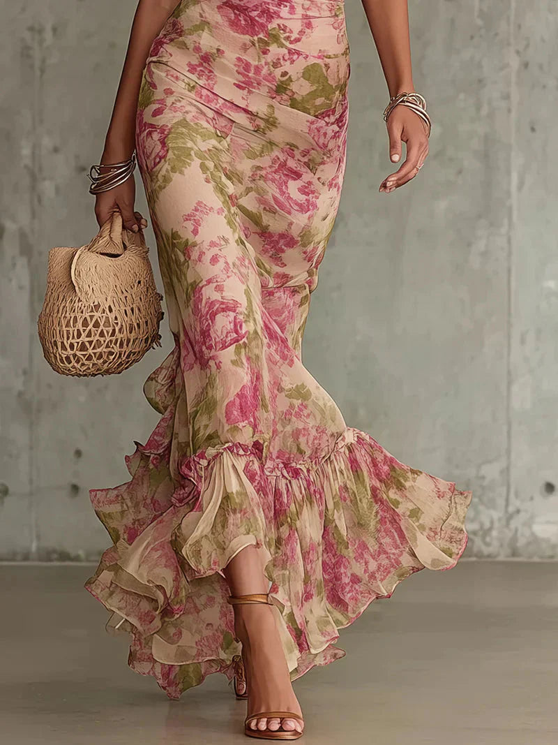 Full-length floral maxi dress with fitted waist and layered ruffle hem detail
