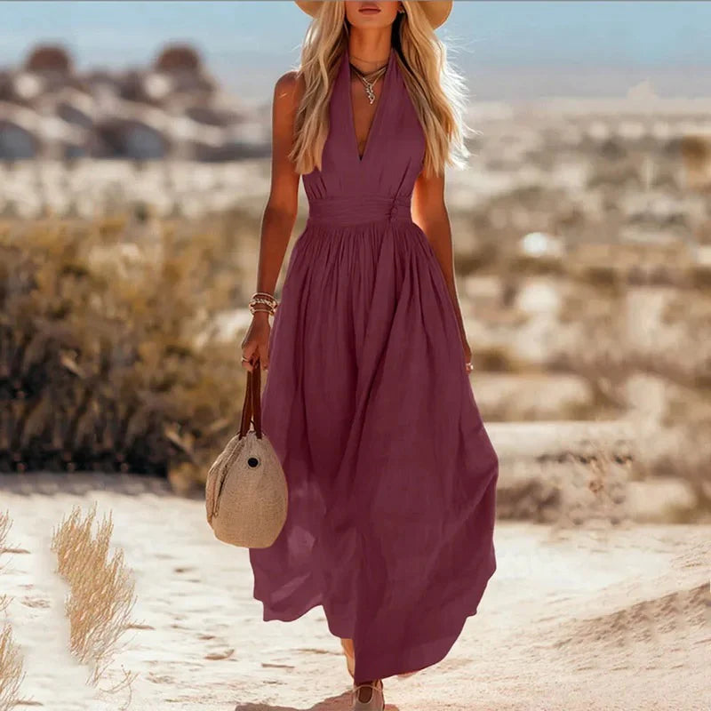 Taupe maxi dress with halter neckline and gathered waist, perfect for summer holidays
