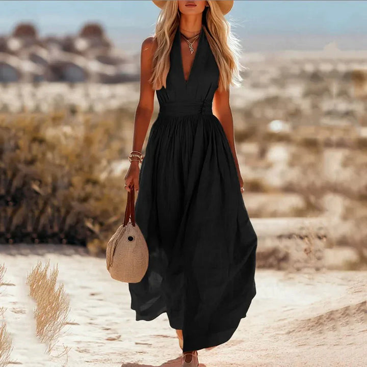 Taupe halter neck maxi dress with gathered waist and flowing silhouette for holidays