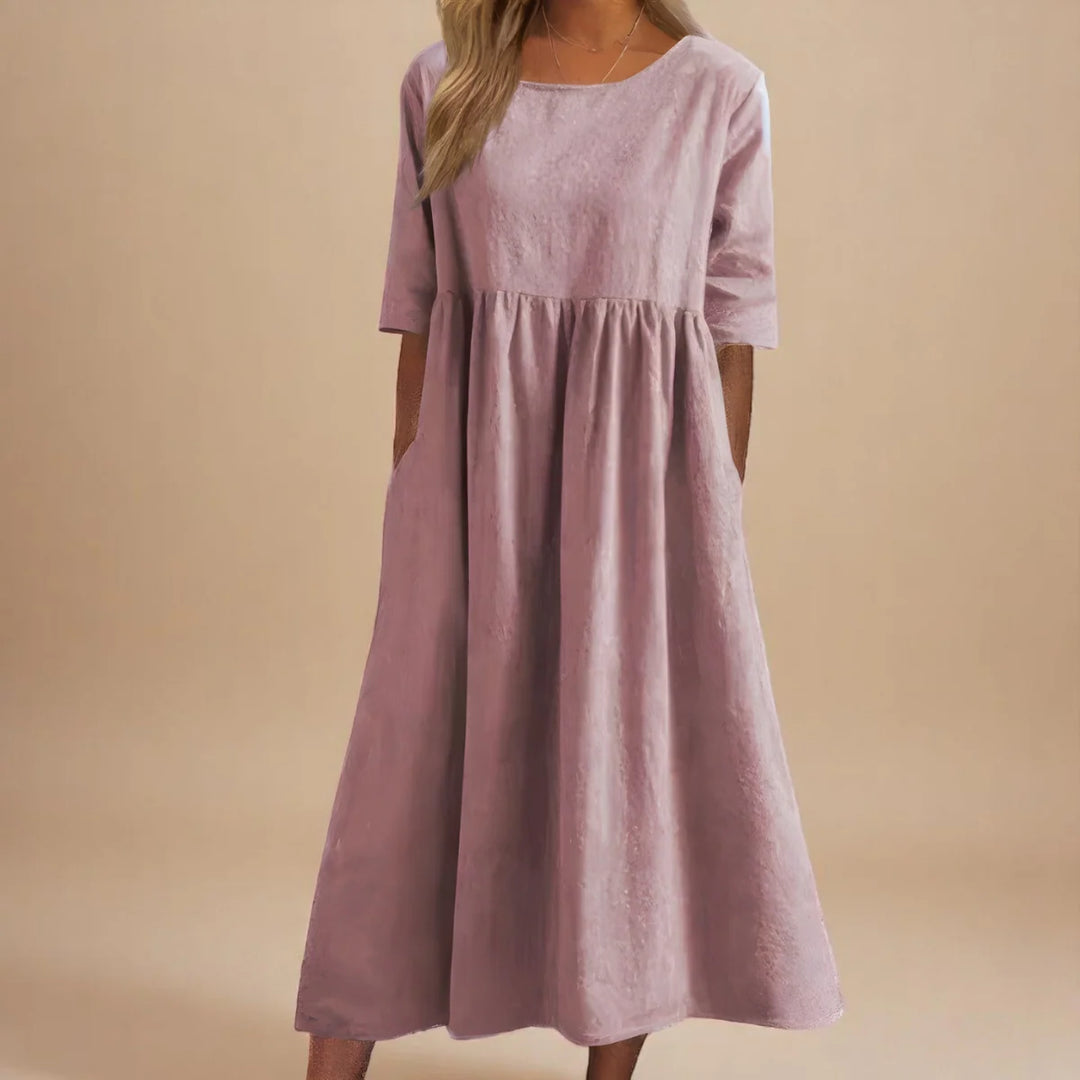 Relaxed midi dress in blue with round neckline and mid-length sleeves for effortless styling