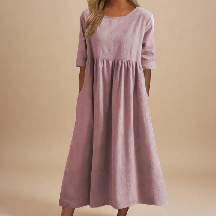 Relaxed midi dress in blue with round neckline and mid-length sleeves for effortless styling