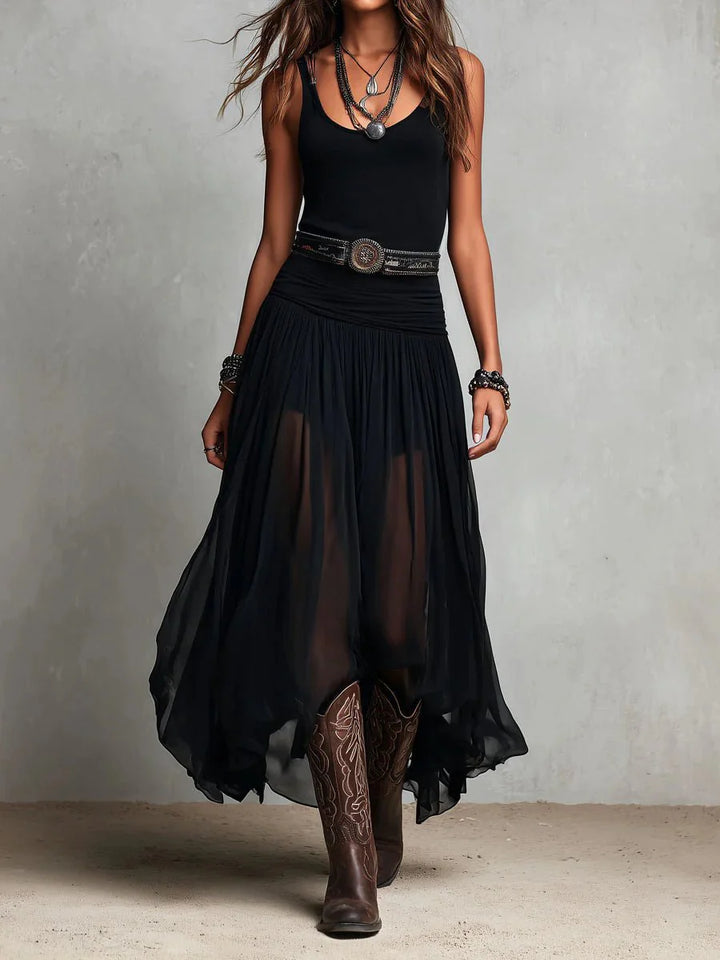 Sleeveless maxi dress with sheer skirt and fitted V-neck bodice paired with western belt