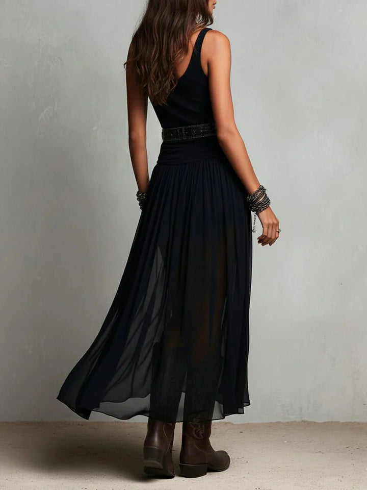 Detail shot of western-style belt on sleeveless maxi dress with sheer overlay