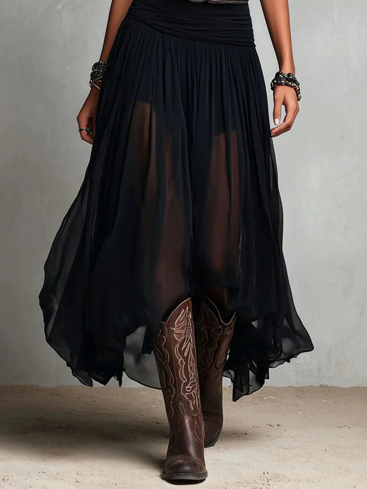 Sleeveless maxi dress with sheer skirt worn in bohemian festival setting