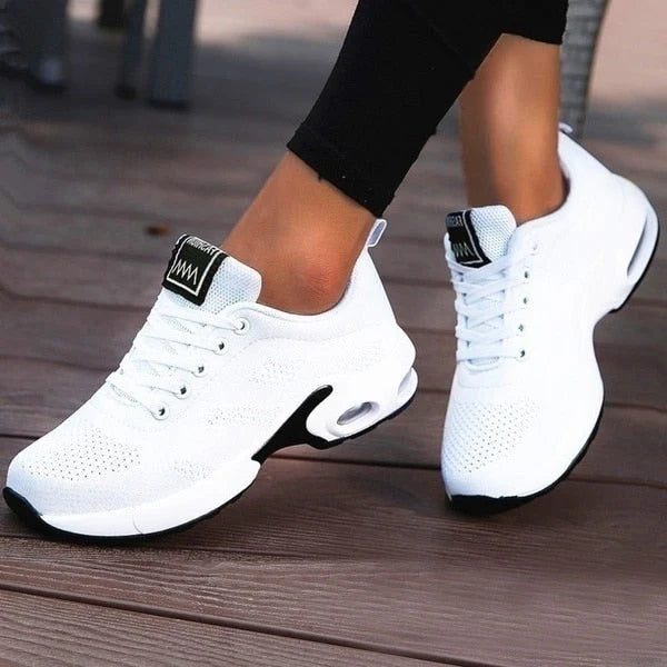 Women's Knit Casual Lace-Up Everyday Sneakers in white with black side panel and cushioned sole