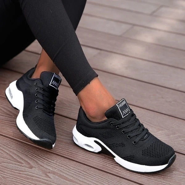 Side view of Women's Knit Casual Lace-Up Everyday Sneakers with contrasting panel and textured outsole