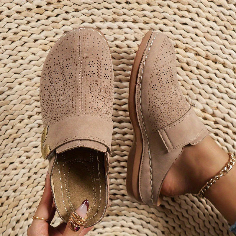 Women's slip-on mules worn with denim jeans and beaded ankle bracelet showing slip-on style