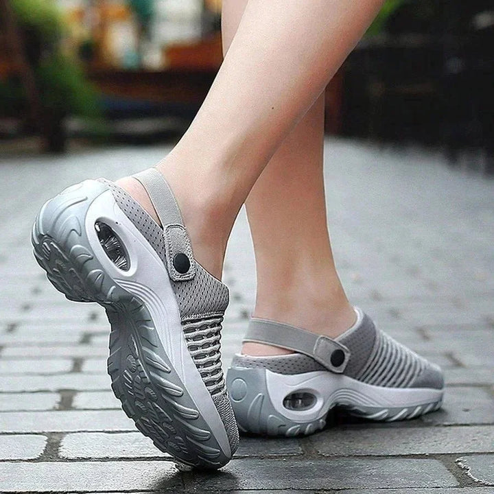 Air-cushioned shoes with strong cushioning for diabetics featuring grey slip-on design with textured sole and adjustable strap
