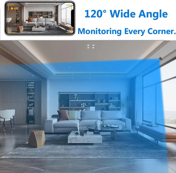 Small black square security camera held between fingers demonstrating compact wireless design and portability