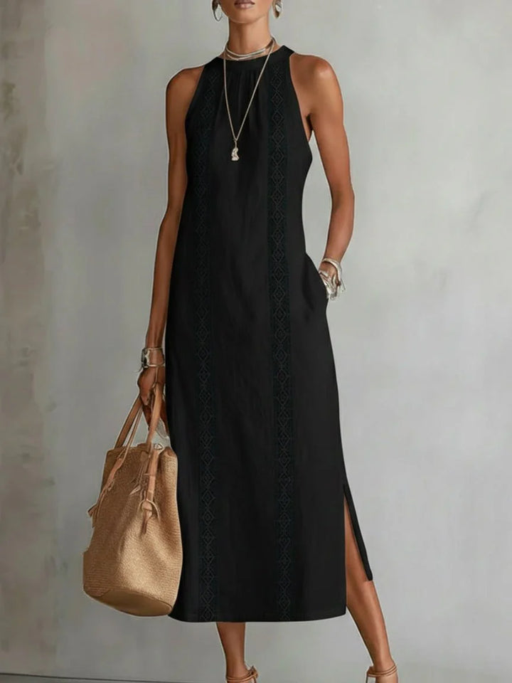 Close-up of embroidered panel texture and stitching detail on midi dress