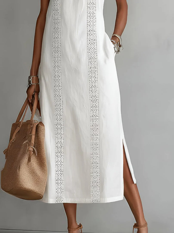 Full-length view of embroidered midi dress showing vertical panel detailing