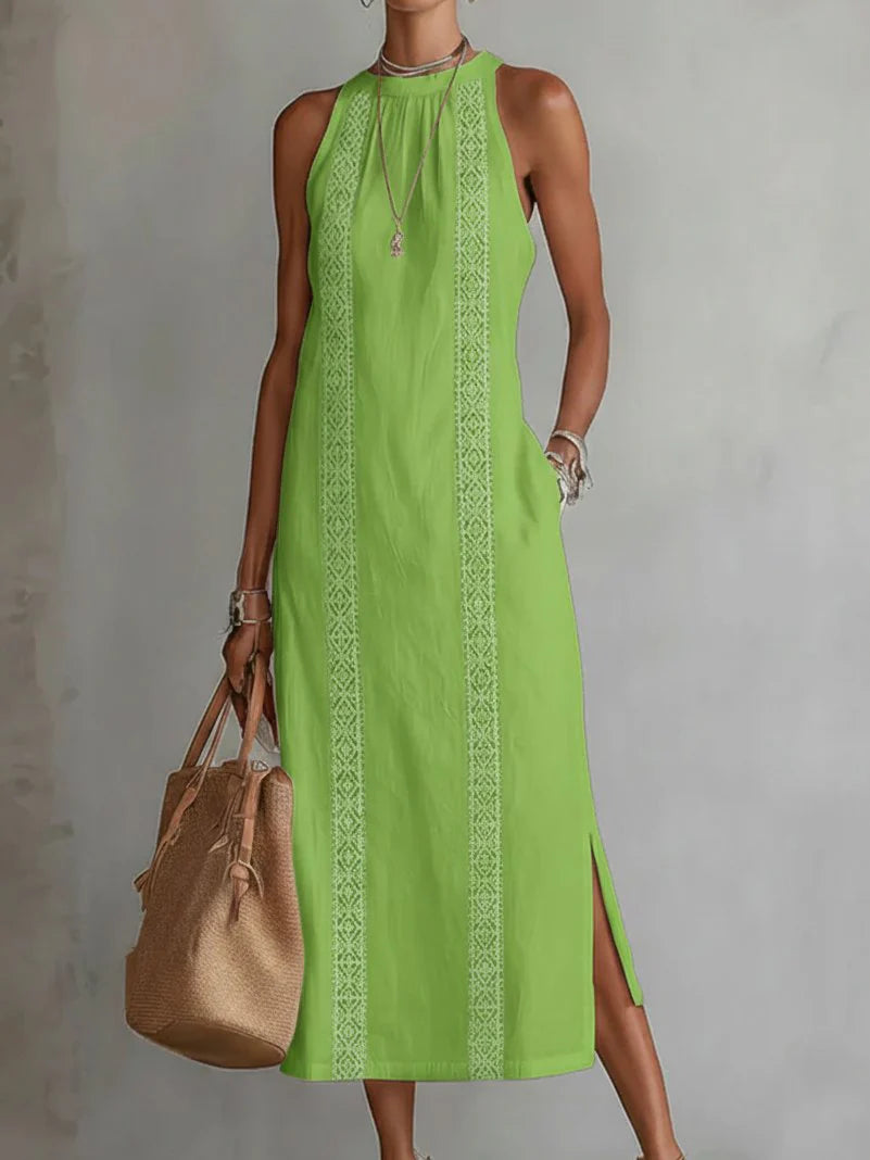 Detail of round neckline and shoulder construction on sleeveless embroidered dress