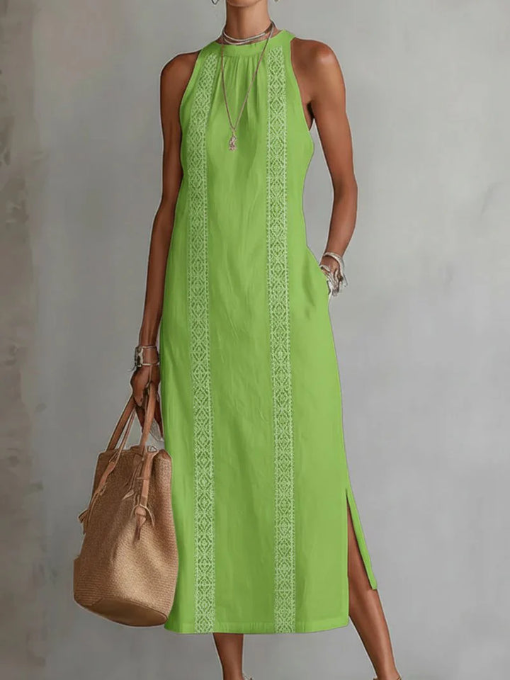 Detail of round neckline and shoulder construction on sleeveless embroidered dress