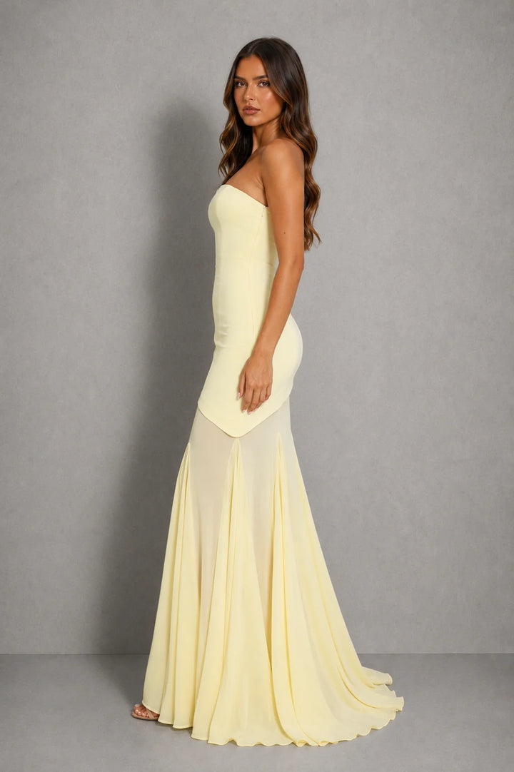Close-up of strapless neckline with grip tape design on women's formal maxi dress for secure fit