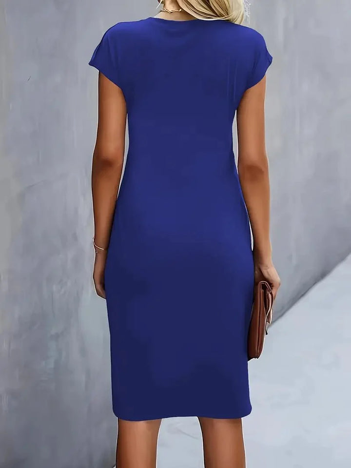 Versatile fitted midi dress with cap sleeves and waist-defining ruching