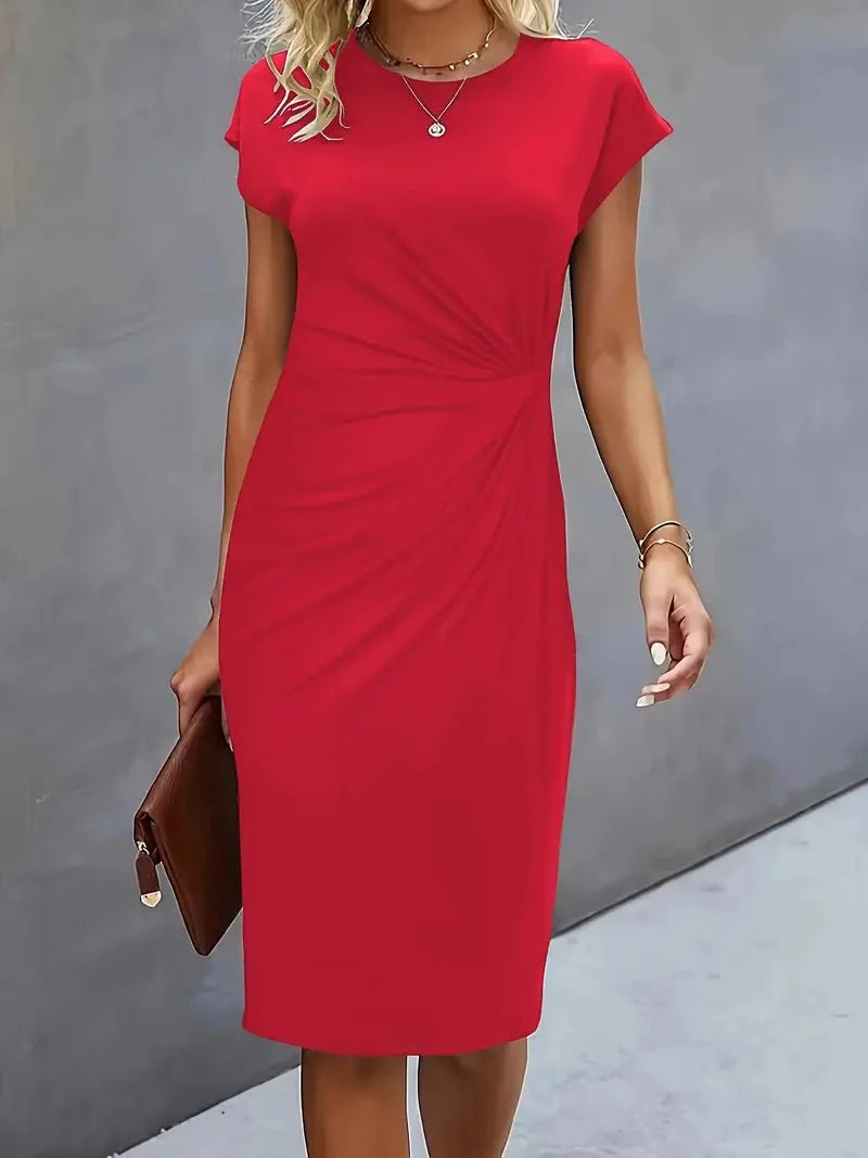 Close-up of twist-ruched waist detail on fitted bodycon midi dress with gathered fabric