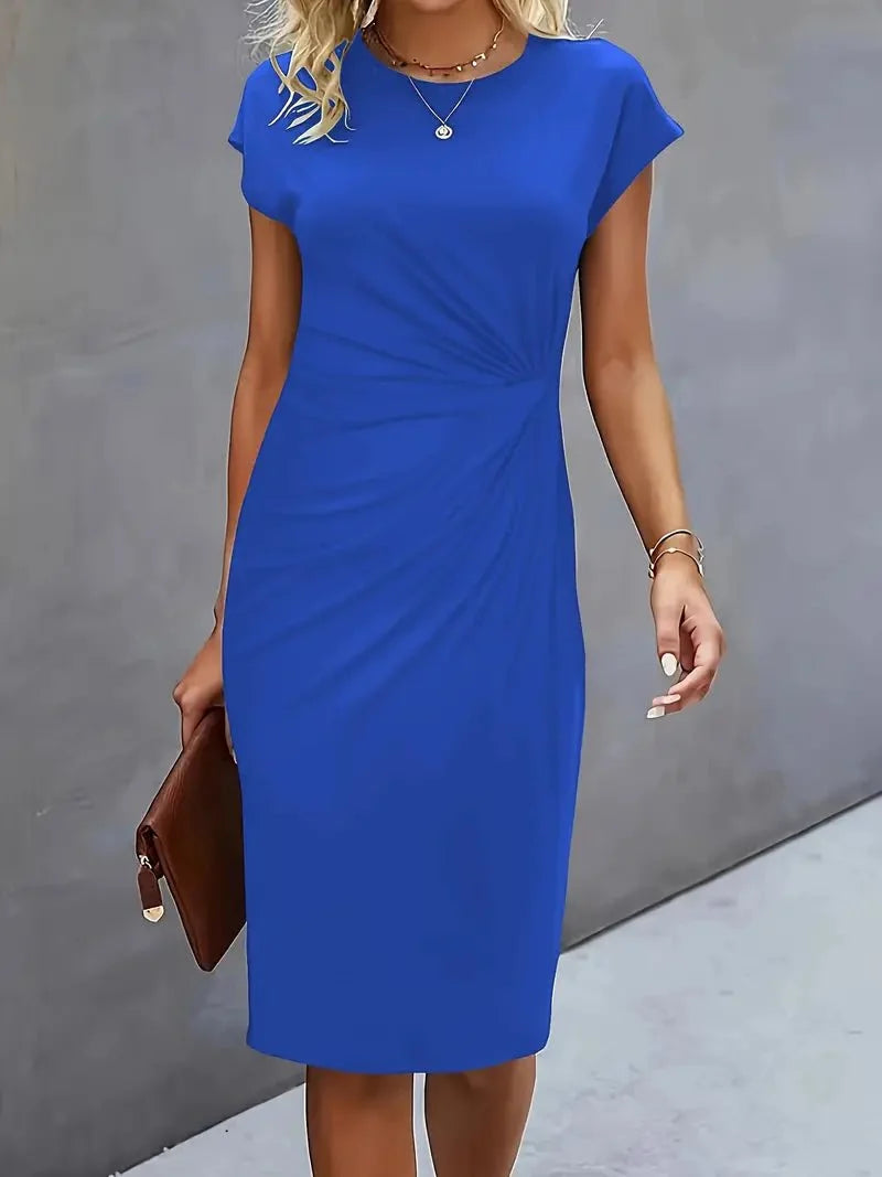 Side view showing sculptural waist ruching and fitted silhouette of midi dress