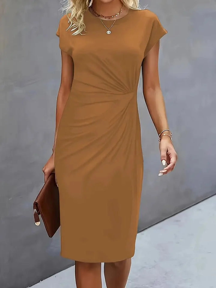 Cap sleeve detail and crew neckline on bodycon midi dress for work occasions