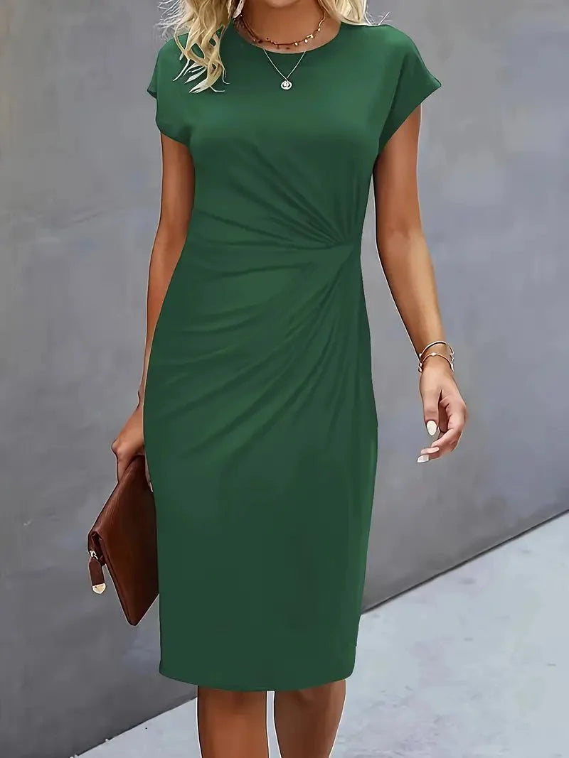 Full-length view of twist-ruched waist bodycon midi dress in office setting