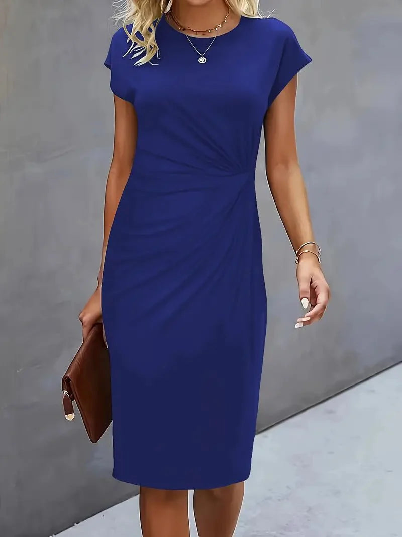 Back view showing clean lines and fitted silhouette of cap sleeve midi dress