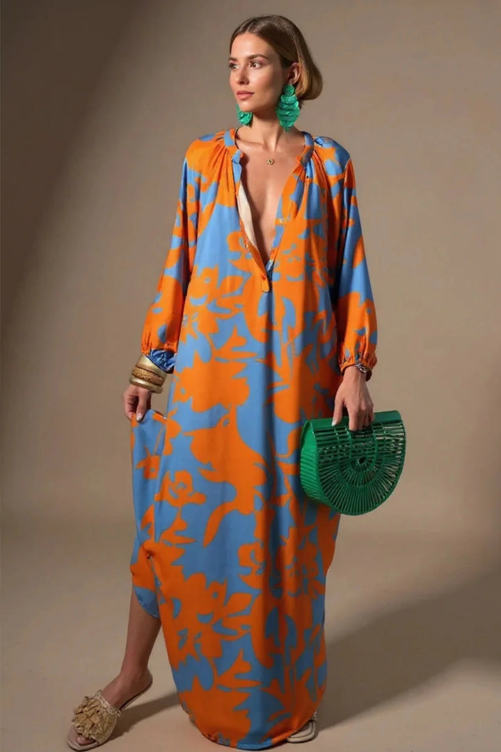Side view of flowing kaftan maxi dress with billowy long sleeves and relaxed oversized silhouette