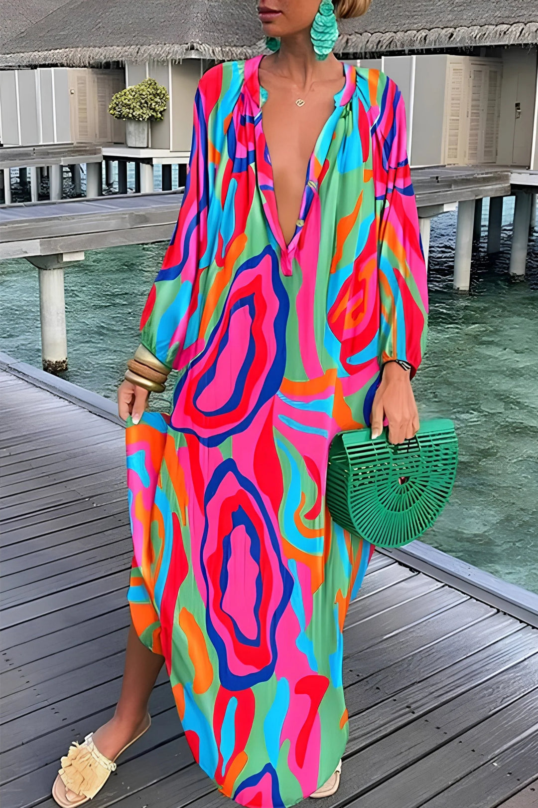 Full-length view of kaftan maxi dress styled with flat sandals and woven bag for resort wear