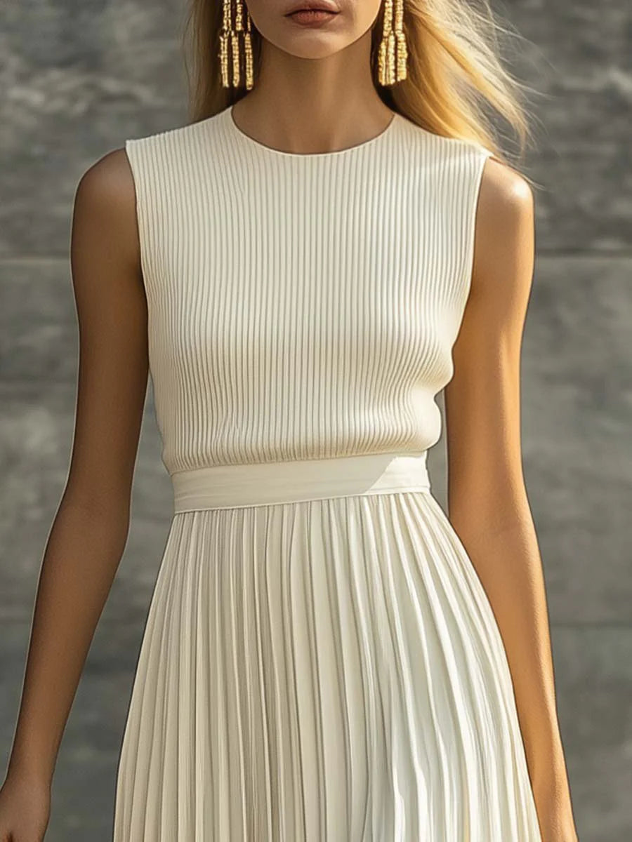 Side view of sleeveless ribbed pleated maxi dress highlighting the flowing pleated skirt and ankle-length hem