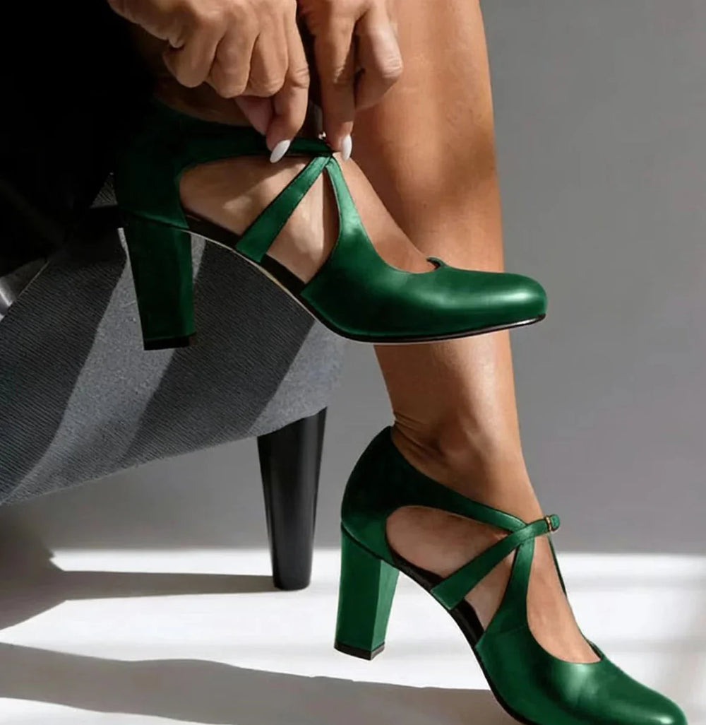 Close-up of women's Mary Jane block heel shoes showing adjustable ankle strap and buckle closure