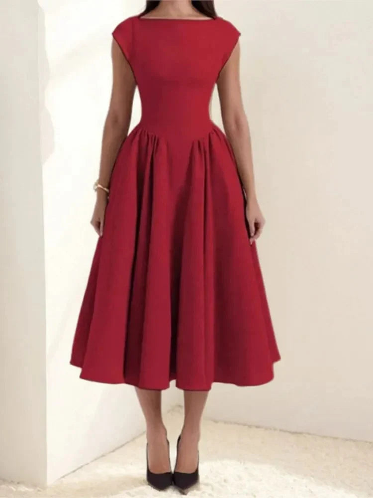 Full skirt midi dress with cap sleeves and fitted bodice shown from front angle
