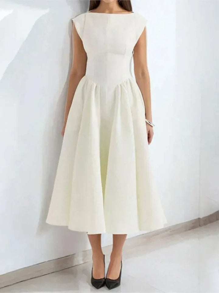 Wedding guest midi dress with vintage inspired full skirt and cap sleeve design
