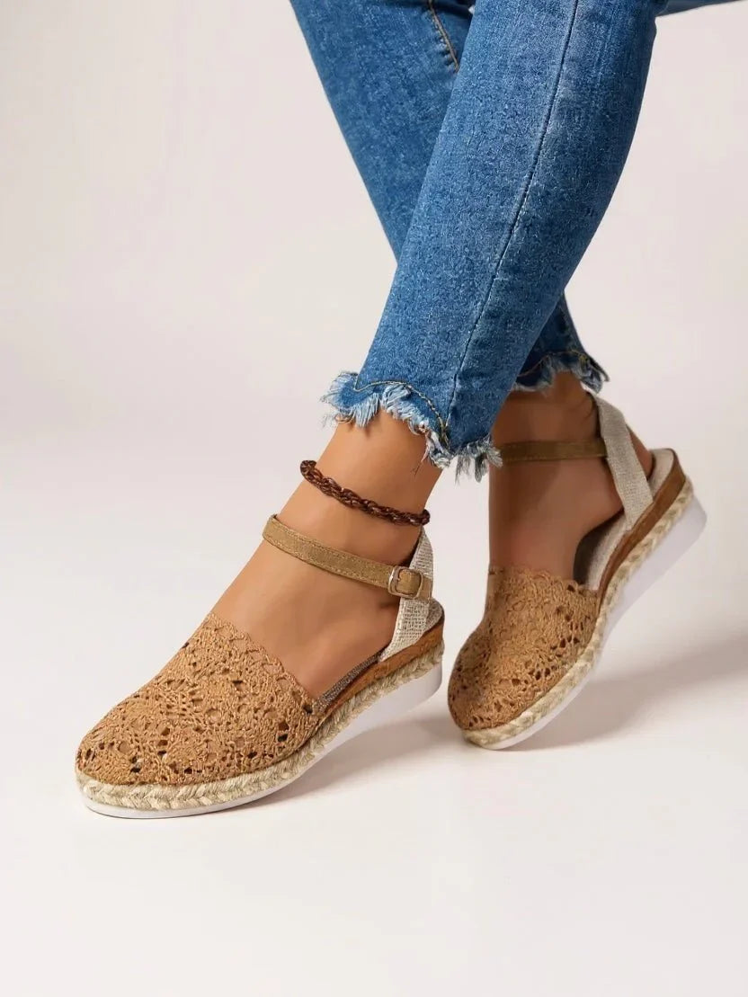 Women's boho platform sandals with crochet woven espadrille detailing and ankle strap closure worn with denim