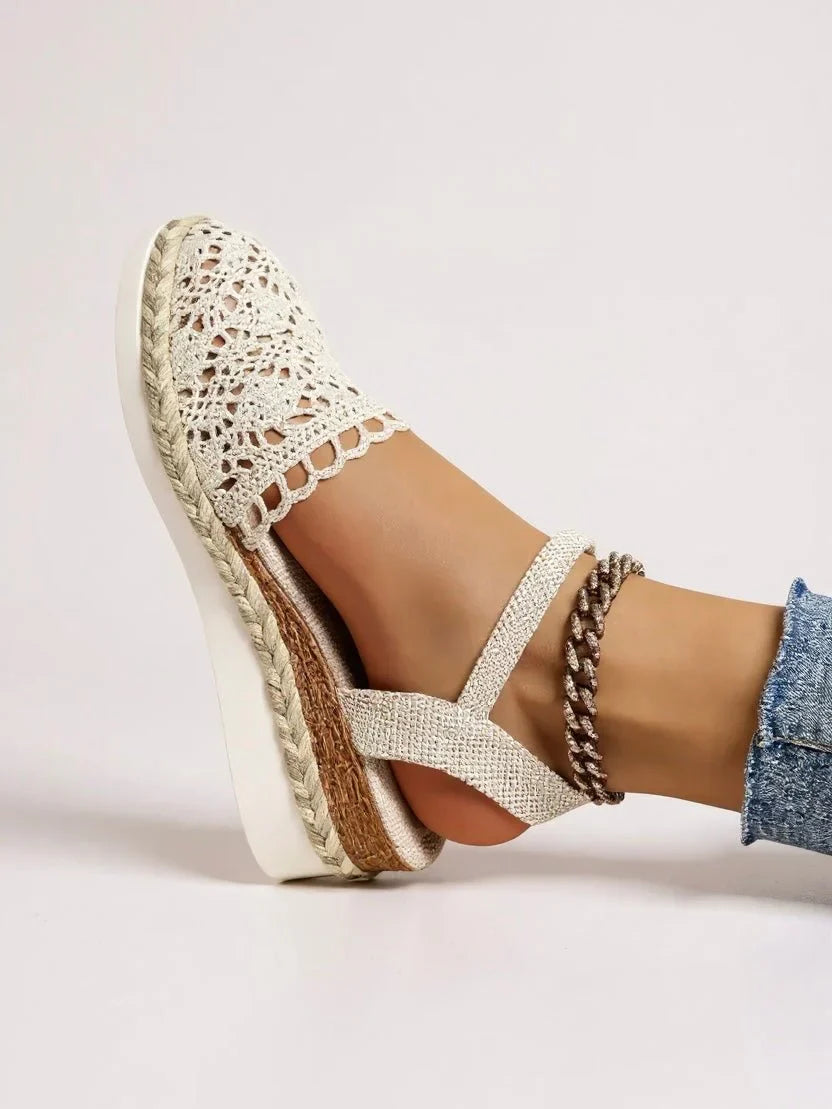 Side view of women's boho platform sandals featuring espadrille-wrapped sole and open crochet upper