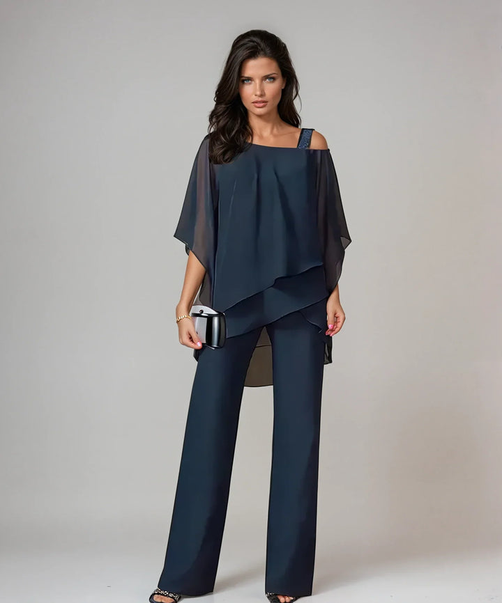 Back view of women's cold shoulder two-piece set with layered overlay design