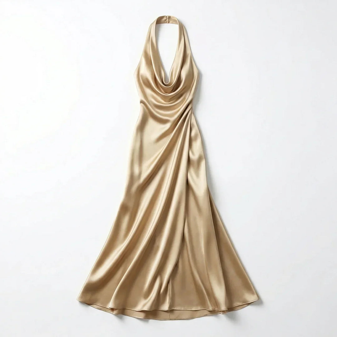 Side view of halter neck maxi dress highlighting sleeveless cut and flowing skirt drape