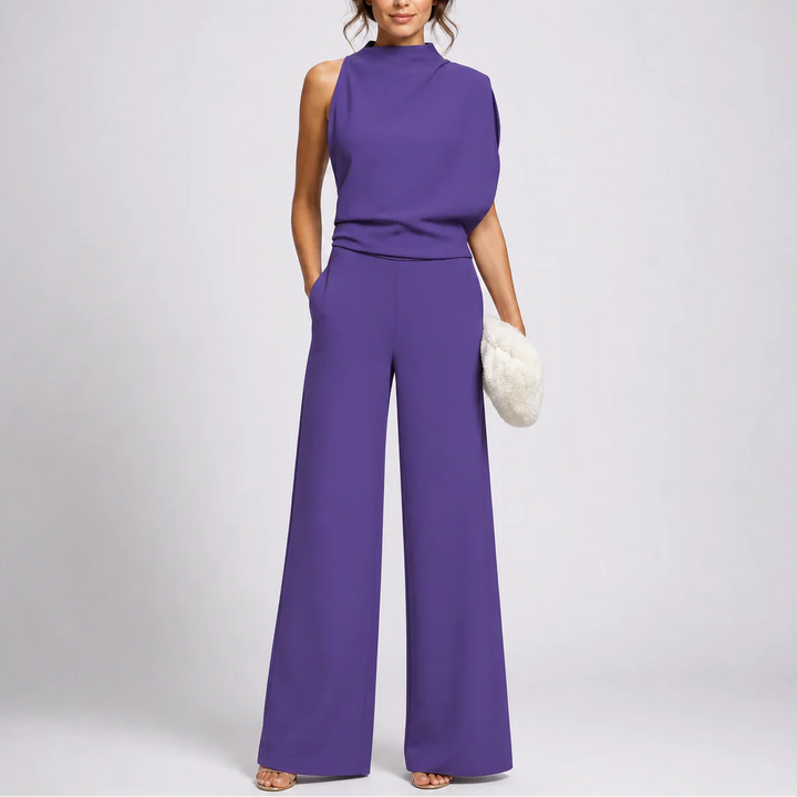 Side angle of high-neck jumpsuit with relaxed fit through the legs