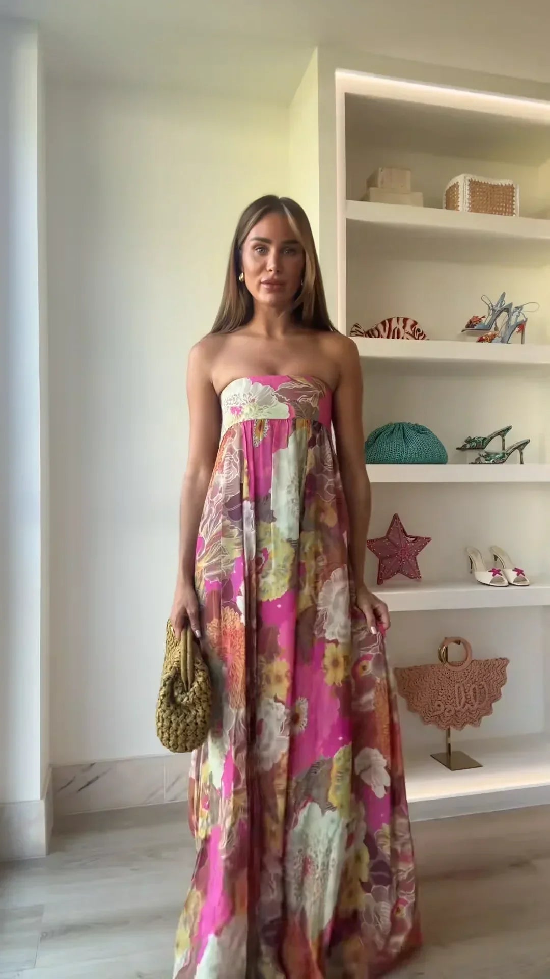 Strapless floral maxi dress shown in natural light displaying vibrant colour palette