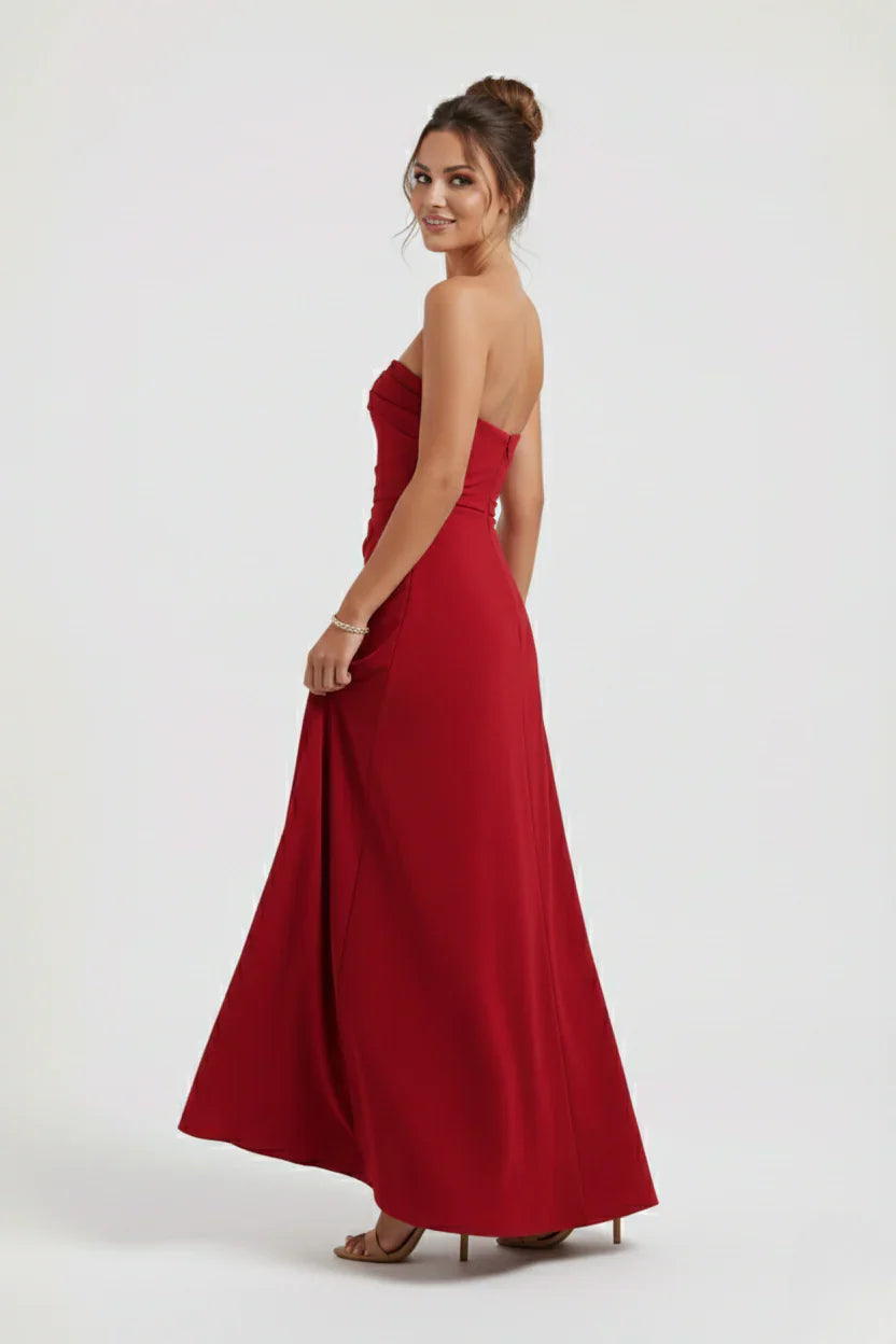 Close-up of strapless neckline and horizontal ruching detail on evening maxi dress