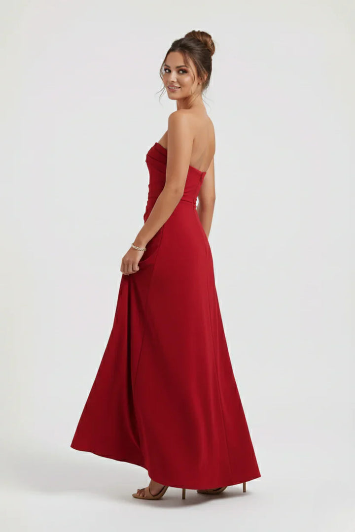 Close-up of strapless neckline and horizontal ruching detail on evening maxi dress